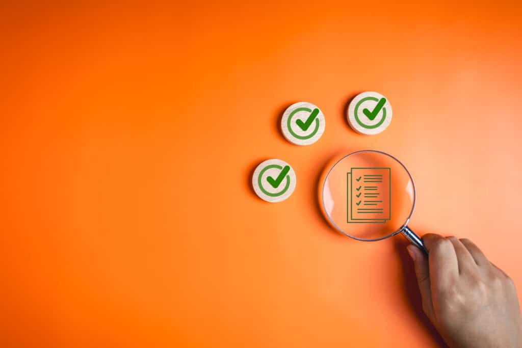 Photos of magnifying glass over a checklist
