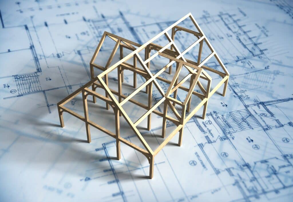 Blueprints and a wooden model house