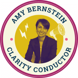 Amy Bertnstein, the Clarity Conductor at BackPocket, smiling confidently in front of a color-blocked background, holding a vibrant pink megaphone.
